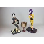 Two Japanese composite dolls on stands in traditional dress, together with a lantern, a mid 20th