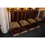 A set of four oak dining chairs with baluster splat back, and velvet drop-in seats, on curved legs