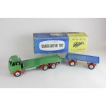 A mechanical Foden Shackleton toy flatbed truck with trailer, with key and wrench, in original box