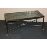 A marble topped rectangular coffee table on reeded brass legs with paw feet, 95cm