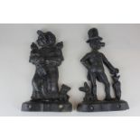 Two cast iron door stops modelled as Punch and Judy (a/f - missing bases)