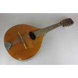 A bouzouki with inlaid panel, interior label stating made in Romania, 61cm