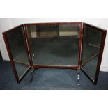 A three-section mahogany dressing table mirror on scroll feet, 61cm high