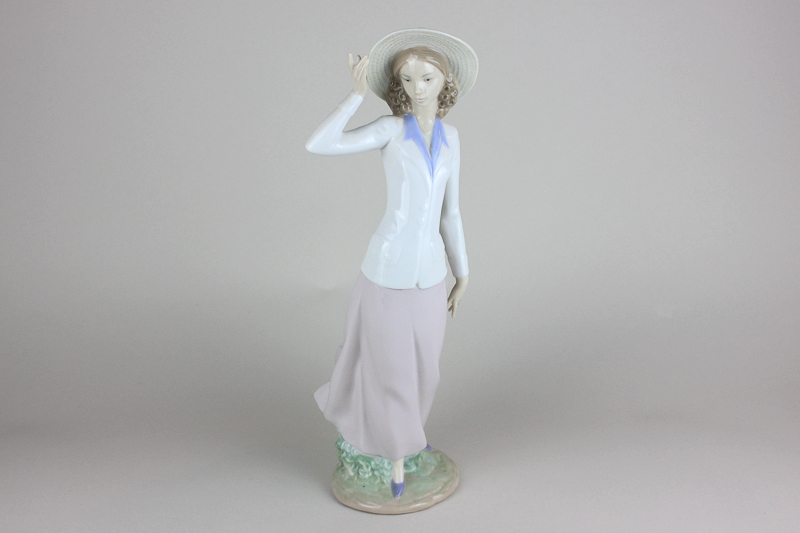 A Lladro porcelain figure Breezy Afternoon (ref 5682), 31cm high, with box