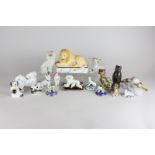 A collection of various Staffordshire pottery and other figures of animals including a lion,