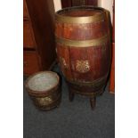 An oak brass bound barrel converted into a chest, together with brass bound oak barrel planter