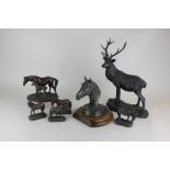 A Heredities bronzed effect model of a stag and a mare and foal, together with a bronze effect resin