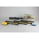 A Graham Favish 00 gauge GWR 9410 locomotive and tender with three Great Western carriages and