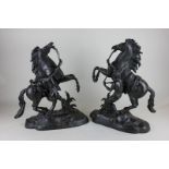 A pair of French bronze models of the Marley horses, 40cm high