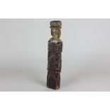 A 19th century carved and painted wooden stump doll of a lady wearing a hat, 27cm