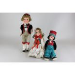 Three German bisque head dolls including one marked HJL in Swiss costume, 34cm