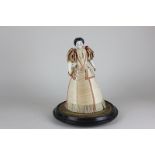 A 19th century porcelain head doll with moulded black hair and blue eyes, in original full length