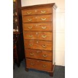A George III style oak tallboy chest of seven long drawers on bracket feet 86.5cm