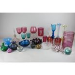 A collection of various coloured glass including two Caithness paperweights, a Swedish glass vase, a