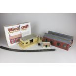 A large collection of 00 gauge model railway accessories including track, stations, signals and