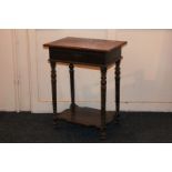 A Victorian work table, with floral carved rectangular top, enclosing fabric lined interior, on