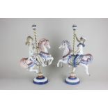 A pair of Lladro porcelain figures  of a boy and a girl on carousel horses (reference 1469 and