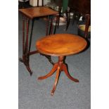 An oval mahogany occasional table, a gilt framed wall mirror and one table from a nest of tables (