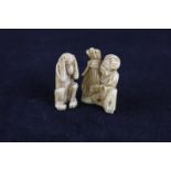 A Japanese carved ivory figure of a seated man with bushel, 4cm and another figure of a monkey,