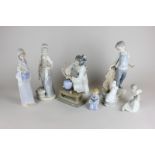 A Lladro porcelain figure of a Japanese woman arranging flowers, in original box, another of a