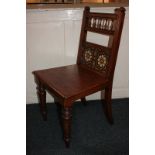 An oak hall chair with tile back, on turned legs