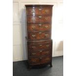 A George III style reproduction walnut chest on chest, four long drawers on brushing slide over