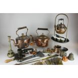 Two copper kettles, a copper kettle on stand, six Indian brass coffee cups with ceramic liners,