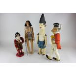 A mixture of various dolls to include a Beefeater, Native American, Sunny Jim cloth figure,