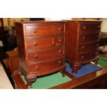 A pair of mahogany miniature chests of four drawers, on bracket feet, 30.5cm