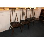 A set of four Ercol oak dining chairs, with five turned back supports, in dark stain (a/f)