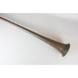 A copper and brass hunting horn, 127cm