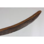 A wooden boomerang, 59cm