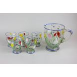 A painted glass lemonade set of jug and five glasses decorated with tulips and wild flowers