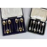 A cased set of six George V silver gilt tea spoons with tongs with chased Hanoverian pattern handles