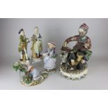 A Capodimonte tramp figure, a Naples porcelain girl ornament, a pair of figures and another figure