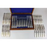 A cased set of twelve silver plated fish knives and forks with chased floral decoration, in mahogany