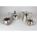 A silver plated three piece tea set with central reeded band, together with a silver plated hot