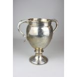 A George V silver two-handled trophy cup with scroll handles and gilt interior, with presentation