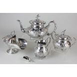 A John Turton silver plated three piece tea set with chased decoration and bird finial, together