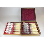 A cased set of twelve pairs of Victorian silver plated fish knives and forks with engraved