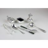 A George V silver cruet, a Victorian silver caddy spoon, a silver cheese scoop, sugar tongs and a