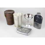 A silver plated beaker in leather case, monogrammed, a double ended cup, a silver plated glass and