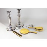 A pair of silver plated column candlesticks with gadroon edging, together with a candle snuffer; a