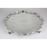 A George V silver salver, maker Atkin Brothers, Sheffield 1931, with piecrust border on scroll feet,