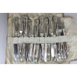 A set of ten silver plated dessert knives with nine matching forks