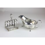 A George VI silver sauce boat, Sheffield 1935, and a George V toast rack, 1910, 8oz