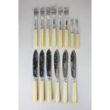 Two sets of three pairs of silver plated fish knives and forks, one set with fluted handles, the
