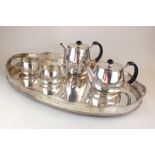 A mid to late 20th century Walker & Hall silver plated four piece tea set and a large plated oval