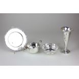 An Elizabeth II silver bonbon dish, a George V silver cream jug, a silver bud vase and a silver