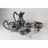 A silver plated four piece tea set with gadroon border, together with two silver plated and glass